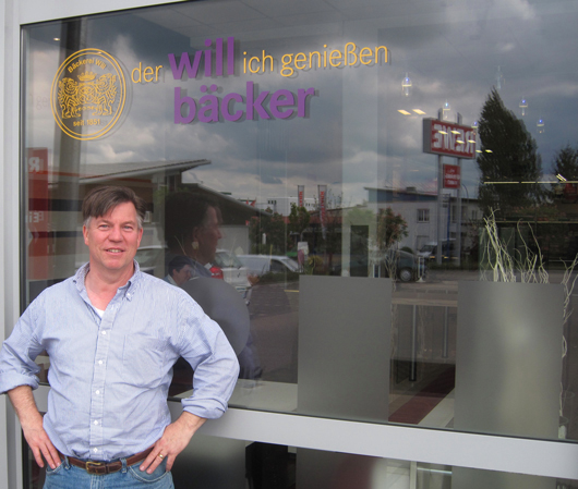 uwe-in-front-of-marcus-bakery-new-signature-sign